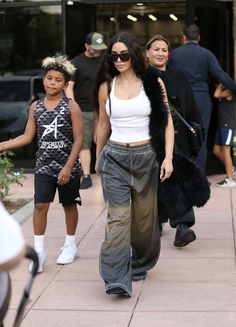 American media personality and socialite Kim Kardashian is seen with her son Saint West as they leave his basketball game on October 4, 2024. (Photo by Thecelebrityfinder/The Mega Agency)