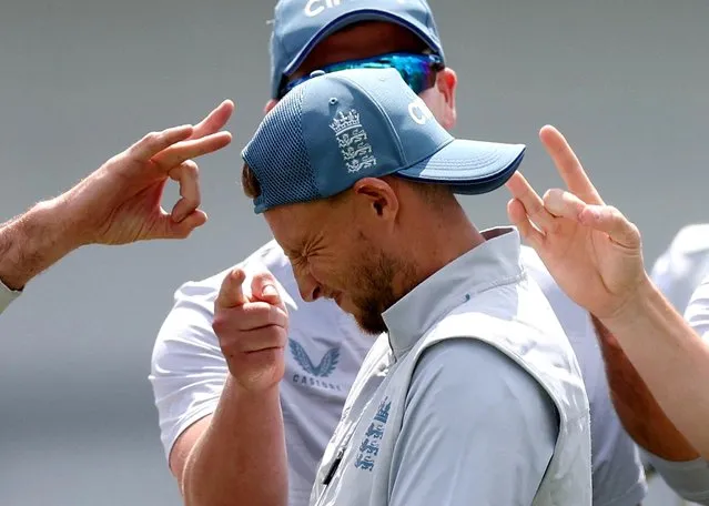 England's Joe Root gets flicked by James Anderson and teammates during nets, at Headingley, Leeds, Britain on Tuesday, June 21, 2022. (Photo by Lee Smith/Action Images via Reuters)