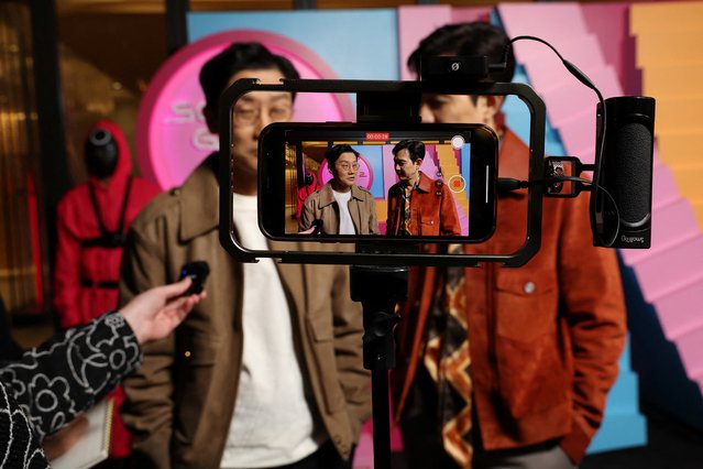 Series creator and director Hwang Dong-hyuk and cast member Lee Jung-jae talk to media at a special event for season 2 of the television series Squid Game in Los Angeles, California, U.S., November 3, 2024. (Photo by Mario Anzuoni/Reuters)