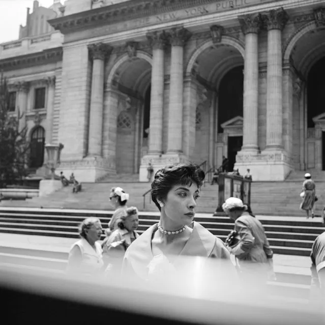 This 1953 photo provided by the Estate of Vivian Maier and John Maloof Collection shows a woman standing outside the New York Public Library in New York. (Photo by Vivian Maier/Estate of Vivian Maier and John Maloof Collection via AP Photo)