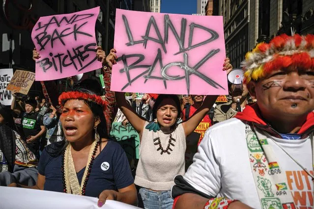 Indigenous community members join activists during a rally organized by youth climate awareness group Fridays for Future to declare a 'climate justice emergency' in New York city on September 23, 2022. (Photo by Ed Jones/AFP Photo)