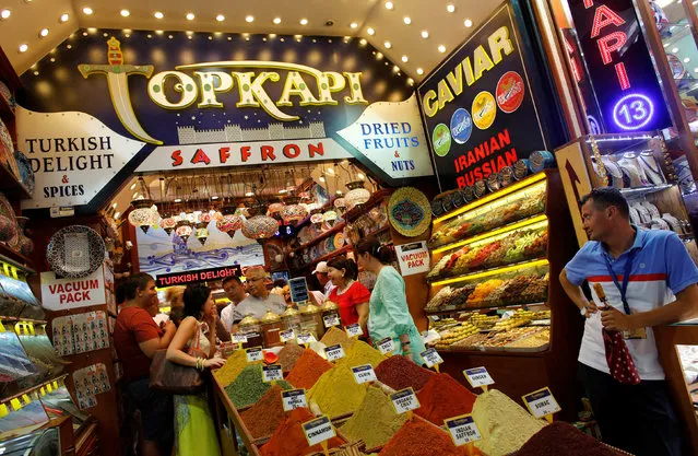 Tourists from Kazakhstan and Russia shop at a store at the Spice market, also known as the Egyptian Bazaar, in Istanbul August 23, 2013. (Photo by Murad Sezer/Reuters)