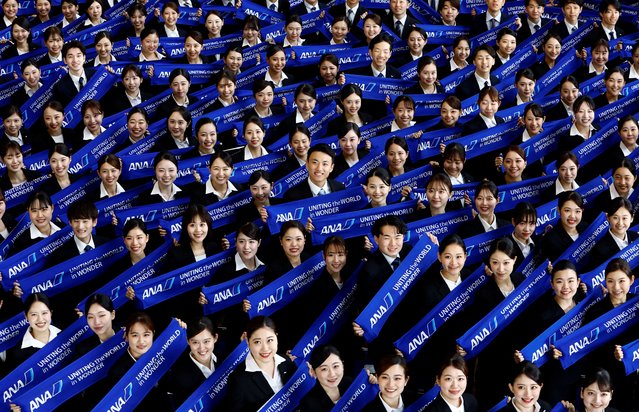 Newly hired employees of All Nippon Airways (ANA) group attend the company group's initiation ceremony at a hangar of Haneda Airport in Tokyo, Japan on April 1, 2025. (Photo by Manami Yamada/Reuters)
