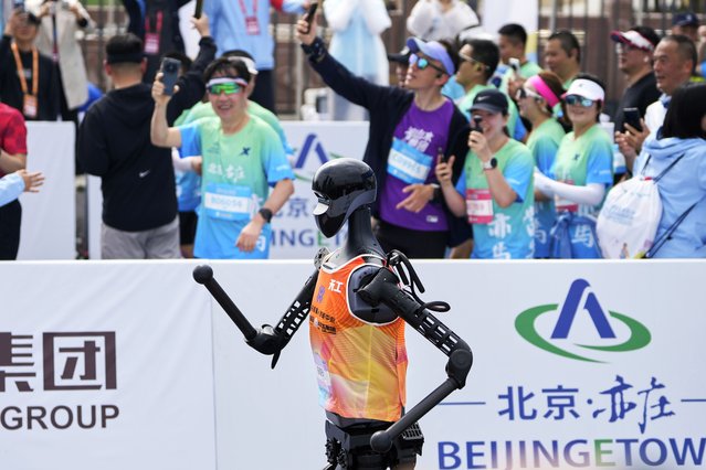 The Sky Project Ultra robot also known as Tien Kung Ultra crosses the finish line to win the Humanoid Robot Half-Marathon held in Beijing on Saturday, April 19, 2025. (Photo by Ng Han Guan/AP Photo)