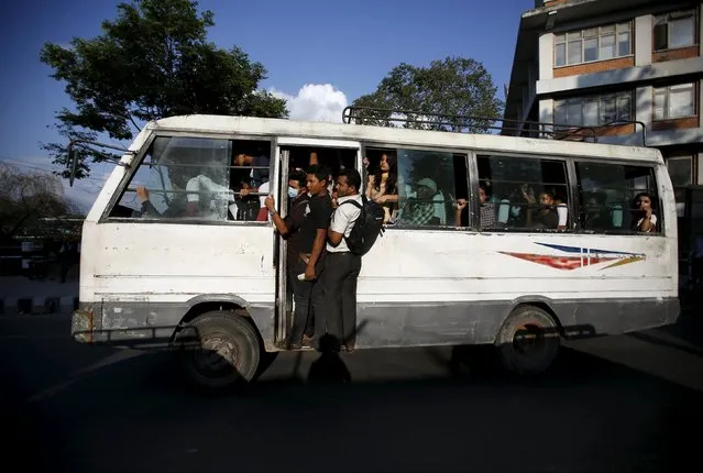 Passengers ride on an overcrowded bus as limited public transportation operates in the city during the ongoing fuel crisis in Kathmandu, Nepal October 1, 2015. Nepal started rationing fuel for vehicles on Sunday, said Nepal Oil Corp spokesman Deepak Baral, after trade ground to a halt at crossing points on the India-Nepal border. (Photo by Navesh Chitrakar/Reuters)