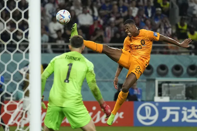 Denzel Dumfries of the Netherlands tries a shoot during the World Cup round of 16 soccer match between the Netherlands and the United States, at the Khalifa International Stadium in Doha, Qatar, Saturday, December 3, 2022. (Photo by Francisco Seco/AP Photo)
