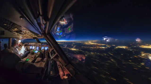 A storm seen from the cockpit. (Photo by Christiaan van Heijst/Caters News Agency)