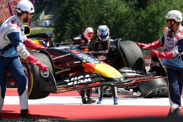 Red Bull's Max Verstappen's car is taken off the track by mechanics as Red Bull's Max Verstappen and Mercedes' Andrea Kimi Antonelli look on during the F1 Austrian Gran Prix in Spielberg, Austria, on June 29, 2025. (Photo by Gintare Karpaviciute/Reuters)