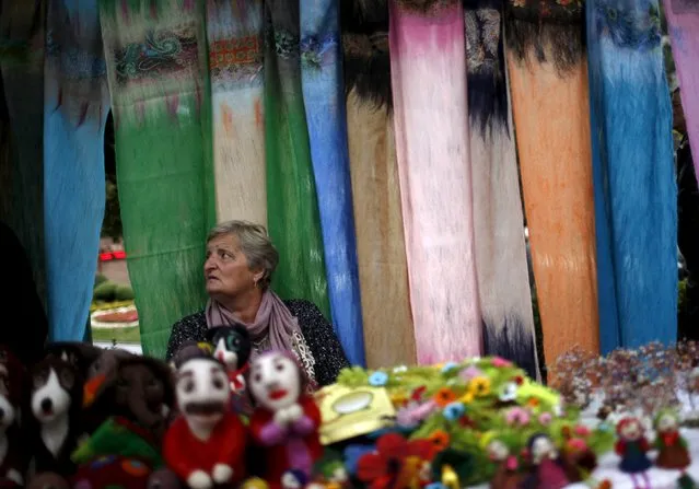A woman sells souvenirs during the annual Tbilisoba festival, celebrating Tbilisi City Day in Tbilisi, Georgia, October 17, 2015. (Photo by David Mdzinarishvili/Reuters)