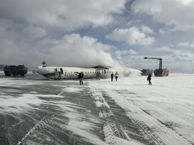 A Delta airlines plane sits on its roof after crashing upon landing at Toronto Pearson Airport in Toronto, Ontario, on February 17, 2025. A Delta Air Lines jet with 80 people onboard crash landed Monday at the Toronto airport, officials said, flipping upside down and leaving at least 15 people injured but causing no fatalities. The Endeavor Air flight 4819 with 76 passengers and four crew was landing at around 3:30 pm in Canada's biggest metropolis, having flown from Minneapolis in the US state of Minnesota, the airline said. (Photo by John Nelson/Facebook)