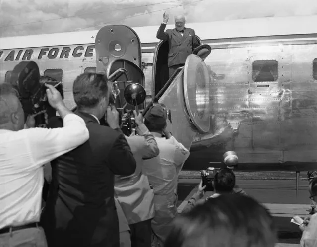British Prime Minister Winston Churchill waves from the door of his plane just before leaving Washington National Airport on June 29, 1954 for Canada after a long weekend of talks with President Eisenhower on the world situation. (Photo by AP Photo)