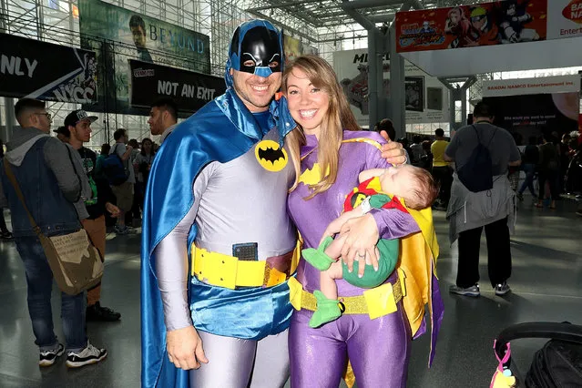 Cosplayers Jon Greer, Ashley Greer and son Grayson Greer dressed as Batman, Batgirl and Robin attend 2016 New York Comic Con – Day 1 on October 6, 2016 in New York City. (Photo by Laura Cavanaugh/Getty Images)