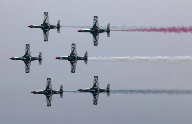 Pakistani Air Force jets demonstrate an aerobatic performance during a full dress rehearsal of a military parade to mark Pakistan's Republic Day in Islamabad, Pakistan, Wednesday, March 21, 2018. Pakistan will celebrate its Republic Day on Friday, March. 23, 2018. (Photo by B.K. Bnagash/AP Photo)