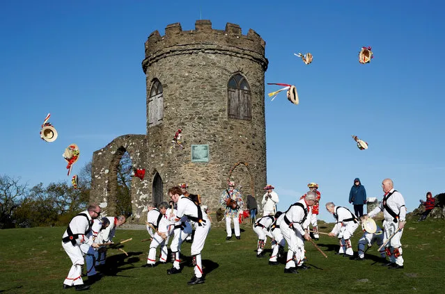 Leicester Morrismen throw their hats during May Day celebrations at Bradgate Park in Newtown Linford, Britain May 1, 2018. (Photo by Darren Staples/Reuters)
