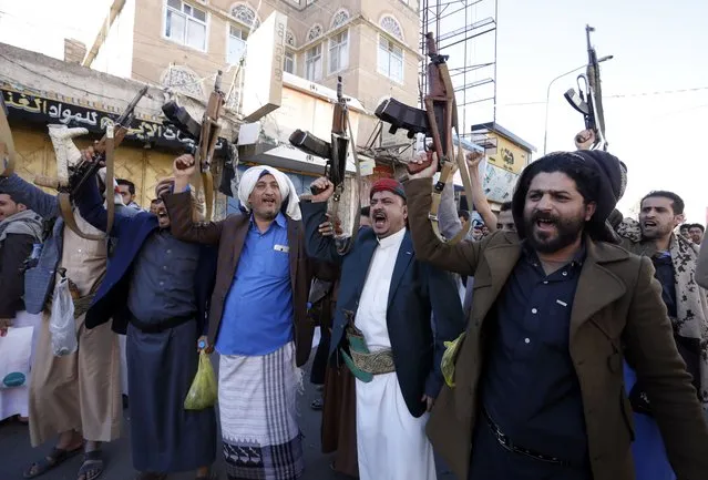 Houthi supporters shout slogans and hold up guns during a protest against the US and Saudi Arabia, in Sana'a, Yemen, 06 January 2023. Thousands of Houthi supporters took part in a protest in Sanaa against the Saudi-led intervention and blockade on Yemen, as US Special Envoy for Yemen Tim Lenderking is in Saudi Arabia to persuade the warring parties in Yemen to renew and expand a UN-mediated truce which expired on 02 October 2022. The Houthis accuse the US of supporting and supplying weapons to the Saudi-led coalition that has been fighting them since March 2015. (Photo by Yahya Arhab/EPA/EFE)
