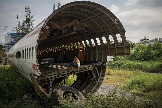 A child perches in one of the fuselages. (Photo by Lauren DeCicca/The Guardian)