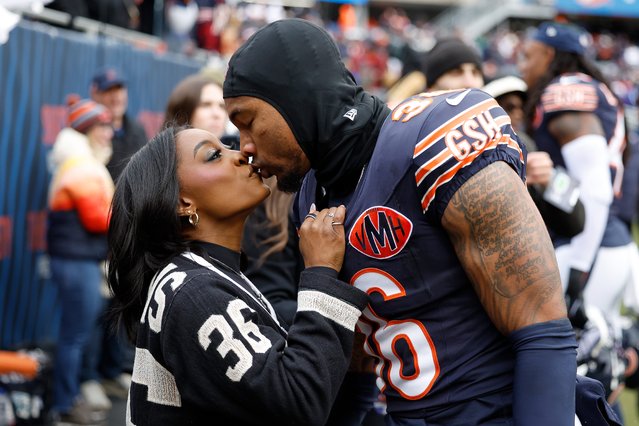 Chicago Bears player Jonathan Owens kisses wife and Olympic champion gymnast Simone Biles before the game against the New York Giants at Soldier Field on November 09, 2025 in Chicago, Illinois. (Photo by USA Today)