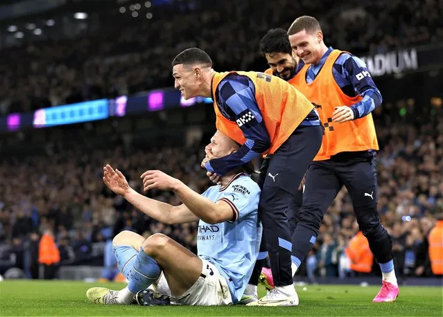 Manchester City striker Erling Harland celebrates with team mates after scoring the 2nd City goal and his record breaking 35th Premier League goal of the season during the Premier League match between Manchester City and West Ham United at Etihad Stadium on May 03, 2023 in Manchester, England. (Photo by Jason Cairnduff/Action Images via Reuters)