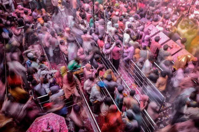 “Melting Pot”. Holi celebration at Banke Bihari, the Hindu temple dedicated to Lord Krishna and located in the holy city of Vrindavan: it's late morning in the temple and the crowd slowly begins to flow outside the temple, while many others continue to celebrate the event. (Photo and caption by Massimiliano De Santis/National Geographic Traveler Photo Contest)