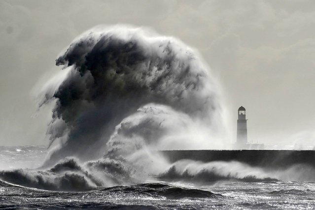Waves crash against the lighthouse in Seaham Harbour, County Durham, UK on Thursday, September 26, 2024. Flooding and travel disruption is set to continue across large swathes of the UK with more rain predicted to hit. Nearly three inches of rain could fall over several hours in the worst-affected regions on Thursday. (Photo by Owen Humphreys/PA Images via Getty Images)