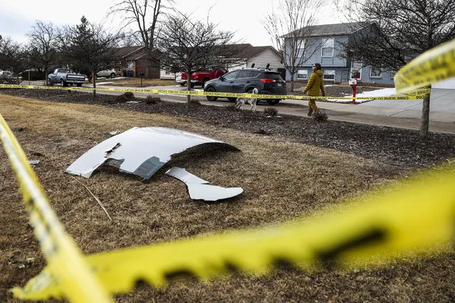 Pieces of an airplane engine from Flight 328 sit scattered in a neighborhood on February 20, 2021 in Broomfield, Colorado. An engine on the Boeing 777 exploded after takeoff from Denver prompting the flight to return to Denver International Airport where it landed safely. (Photo by Michael Ciaglo/Getty Images)