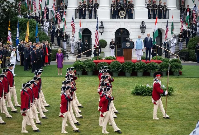 US President Joe Biden and India's Prime Minister Narendra Modi, with First Lady Jill Biden (L), watch the Fife and Drum Corps perform during a welcoming ceremony for Modi in the South Lawn of the White House in Washington, DC, on June 22, 2023. (Photo by Andrew Caballero-Reynolds/AFP Photo)