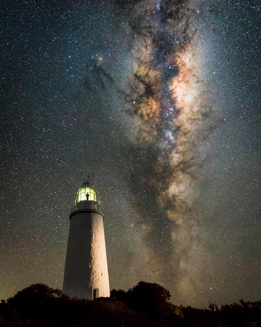 The Milky Way rises above an isolated lighthouse in Tasmania. Shot by James Stone of Australia. (Photo by James Stone/Astronomy Photographer of the Year 2018)