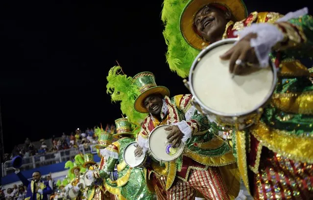 Revellers from Academicos do Tucuruvi Samba School take part in a carnival at Anhembi Sambadrome in Sao Paulo February 14, 2015. (Photo by Nacho Doce/Reuters)
