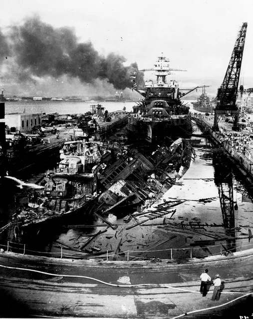 The destroyers USS Downes and USS Cassin lie wrecked in Drydock One ahead of the battleship USS Pennsylvania soon after the end of the Japanese air attack on Pearl Harbor, Hawaii, U.S. December 7, 1941.  The 75th anniversary of the attack, which brought the United States into World War Two, is marked on December 7, 2016. (Photo by Navy Photographer's Mate Harold Fawcett/Reuters/U.S. Navy/National Archives)