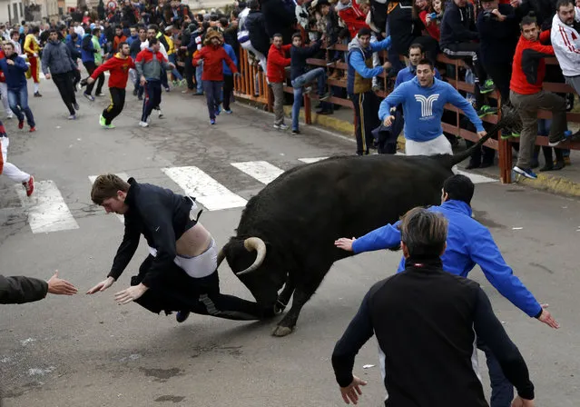 Benjamin Miller, 20, from Georgia, is gored by a bull during the “Carnaval del Toro” in Ciudad Rodrigo, Spain, on Sunday, February 15, 2015. An American youth is recovering in the intensive-care unit of a hospital in western Salamanca after being savagely gored during a bullfighting festival celebrating Carnival, officials said Sunday. (Photo by Jose Vicente/AP Photo)