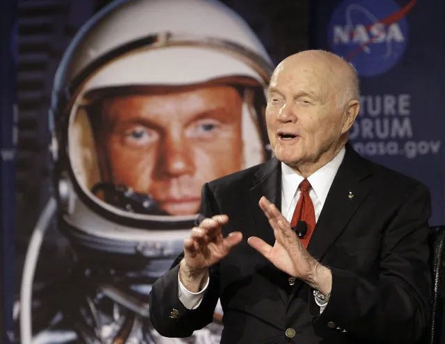 In this February 20, 2012, file photo, U.S. Sen. John Glenn talks with astronauts on the International Space Station via satellite before a discussion titled “Learning from the Past to Innovate for the Future” in Columbus, Ohio. (Photo by Jay LaPrete/AP Photo)