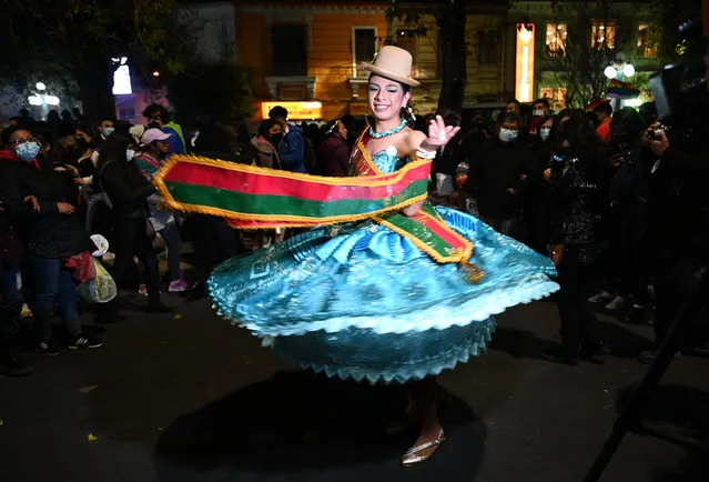An attendee dressed in traditional costume dances during the Pride Parade in La Paz, on June 25, 2022. (Photo by Aizar Raldes/AFP Photo)