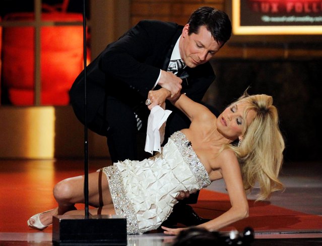 Host Sean Hayes picks Kristin Chenoweth (R) off the ground during a joke at the American Theatre Wing's 64th annual Tony Awards ceremony in New York, June 13, 2010. (Photo by Gary Hershorn/Reuters)