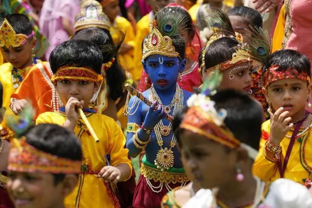 Schoolchildren dressed as Hindu god krishna participate in Janmashtami celebrations in Shivaji Shikshan Sanstha school in Mumbai, India, Tuesday, September 5, 2023. The festival celebrates the birth of Krishna. (Photo by Rajanish Kakade/AP Photo)