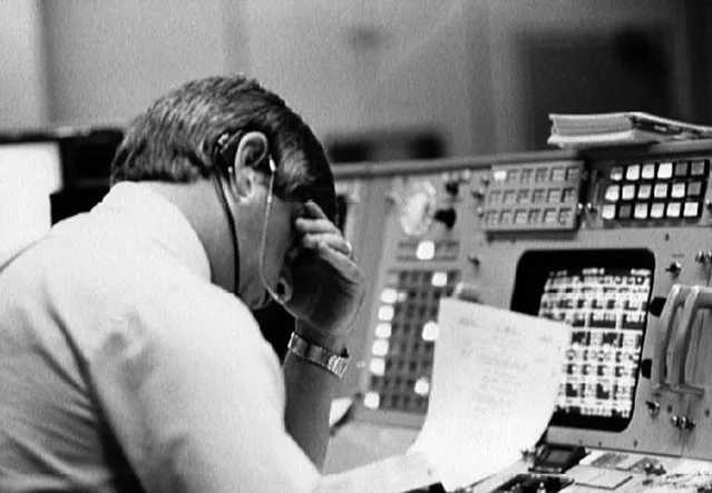 Flight director Jay Greene studies data at his console inside Johnson Space Center's Mission Control Center in Texas, just minutes after the announcement that Challenger's ascent was not nominal. (Photo by NASA)