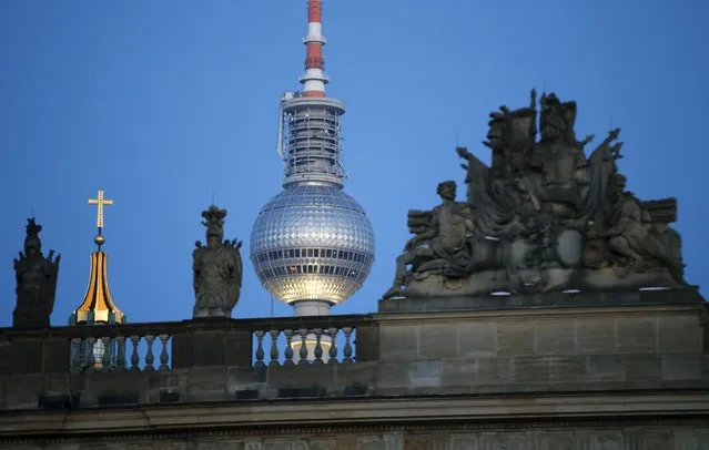 The TV Tower (C) and the cross on top of the Berlin Cathedral are pictured next to the Zeughaus (old Arsenal) in Berlin, Germany, January 22, 2016. (Photo by Fabrizio Bensch/Reuters)