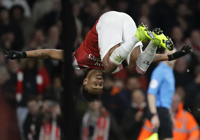Arsenal's Pierre-Emerick Aubameyang celebrates after scoring his side's fourth goal during the English Premier League soccer match between Arsenal and Fulham at Emirates stadium in London, Tuesday, January 1, 2019. (Photo by Kirsty Wigglesworth/AP Photo)