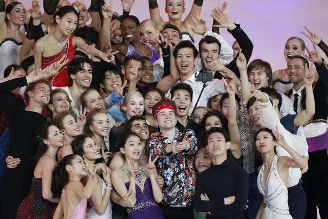 Skaters in the Exhibition event pose for a “selfie” photo in the ISU World Figure Skating Championship 2015 held at the Oriental Sports Center in Shanghai, China, Sunday, March 29, 2015. (Photo by Ng Han Guan/AP Photo)