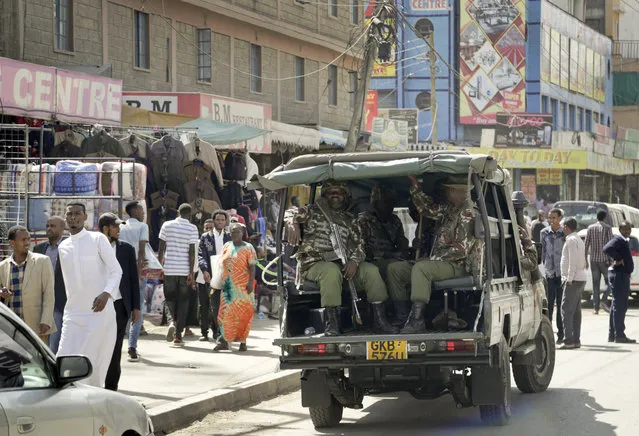 Kenyan police make a routine patrol in the Eastleigh area of the capital Nairobi, Kenya, Friday, January 18, 2019. Extremists stormed a luxury hotel complex in Kenya's capital on Tuesday, setting off explosions and gunning down people at cafe tables in an attack claimed by militant group al-Shabab. (Photo by Khalil Senosi/AP Photo)
