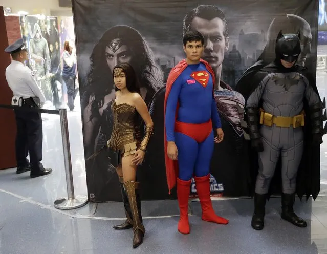 Filipino fans of DC comics super heroes pose at the country's largest shopping mall during an attempt to establish a world record for the most number wearing their favorite costumes Saturday, April 18, 2015 at suburban Quezon city, northeast of Manila, Philippines. (Photo by Bullit Marquez/AP Photo)