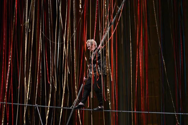 French high wire artist Philippe Petit performs “The Ribbon Walk” above an audience at The Cathedral of St. John the Divine in New York on February 1, 2024. (Photo by Angela Weiss/AFP Photo)