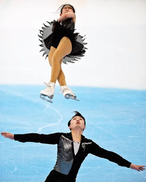 Zhang Siyang and Yang Yongchao of China perform in the pairs short program competition at the Asian Open Figure Skating Trophy, a test event for the 2022 Winter Olympics, at the Capital Indoor Stadium in Beijing, Thursday, October 14, 2021. (Photo by Mark Schiefelbein/AP Photo)