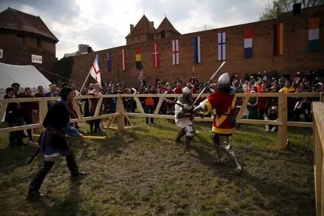 Spanish fighter Jose Amoedo fights with English fighter Pawel Kurzak in their pole arm duel during the Medieval Combat World Championship at Malbork Castle, northern Poland, April 30, 2015. (Photo by Kacper Pempel/Reuters)