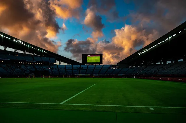 The dramatic sky above the stadium during the Tokyo 2020 Olympic Games women's quarter-final football match between Canada and Brazil at Miyagi Stadium in Miyagi on July 30, 2021. (Photo by Philip Fong/AFP Photo)