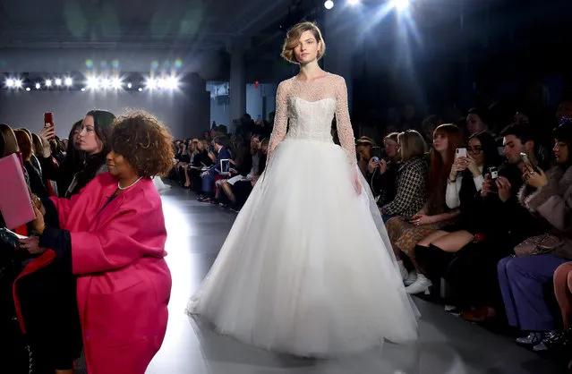 Fashion from the Amsale bridal collection is modeled, Friday April 12, 2019 in New York. (Photo by Bebeto Matthews/AP Photo)