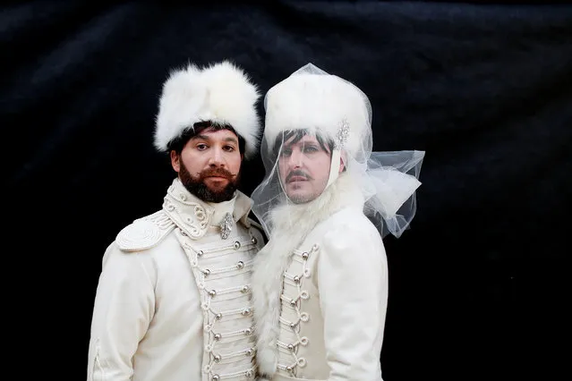 Revellers pose in Saint Mark's Square during the Venice Carnival, in Venice, Italy February 19, 2017. (Photo by Alessandro Bianchi/Reuters)