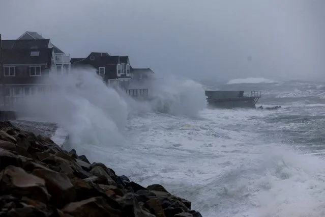 Waves crash over the seawall in front of homes in Marshfield, Massachusetts, USA, 13 February 2024. A Nor'easter storm brought high winds and snow to the region. (Photo by CJ Gunther/EPA/EFE/Rex Features/Shutterstock)