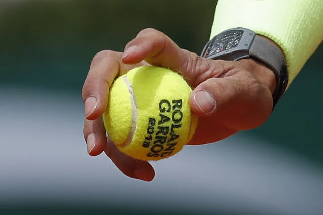 In this Monday, May 27, 2019, file photo, Spain's Rafael Nadal prepares to serve against Germany's Yannick Hanfmann during their first round match of the French Open tennis tournament at the Roland Garros stadium in Paris. English-speakers tend to go with “French Open”, even though that's not used by the event itself. Most of the rest of the world says “Roland Garros”, which is the facility that hosts the tournament and is named in memory of a World War I fighter pilot. But what hardly ever is uttered is the original name of the tournament “Internationaux de France”, which translates to “International Championships of France”. (Photo by Pavel Golovkin/AP Photo/File)