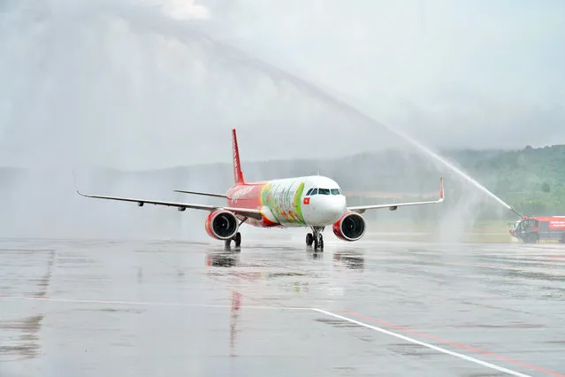 A Vietjet Air plane lands on Phu Quoc island, in Vietnam, Saturday, November 20, 2020. More than 200 foreign tourists arrived on Vietnam's largest Phu Quoc island on Saturday, being the first to visit the Southeast Asian country after nearly two years of border closure due to COVID-19. (Photo by VietjetAir via AP Photo)