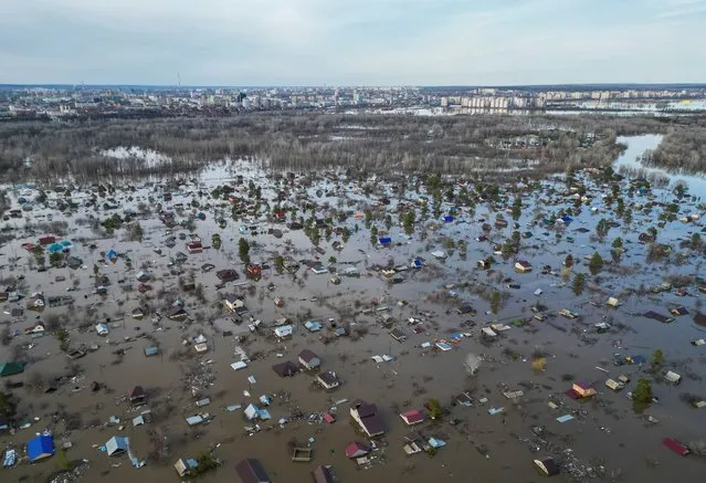 A drone view shows a flooded residential area in the settlement of Zarechnoye, Orenburg region, Russia, on April 11, 2024. (Photo by Reuters/Stringer)